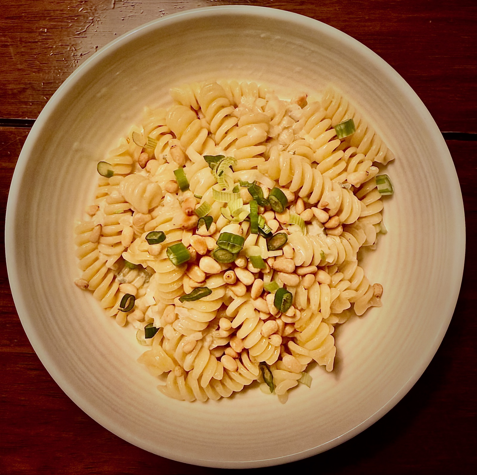 Fusilli in creamy Gorgonzola sauce topped with toasted pine nuts and fresh chives