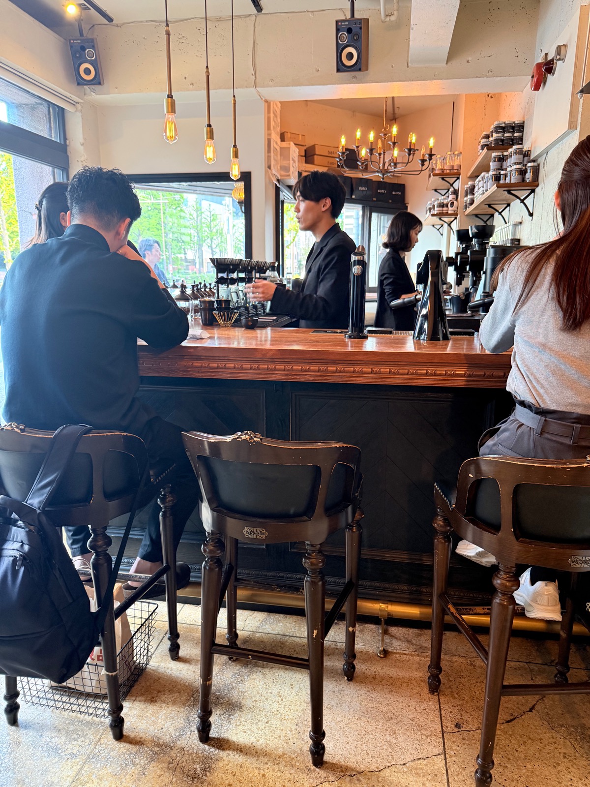 Inside Glitch Coffee & Roasters, Kanda — bar counter with pendant lights