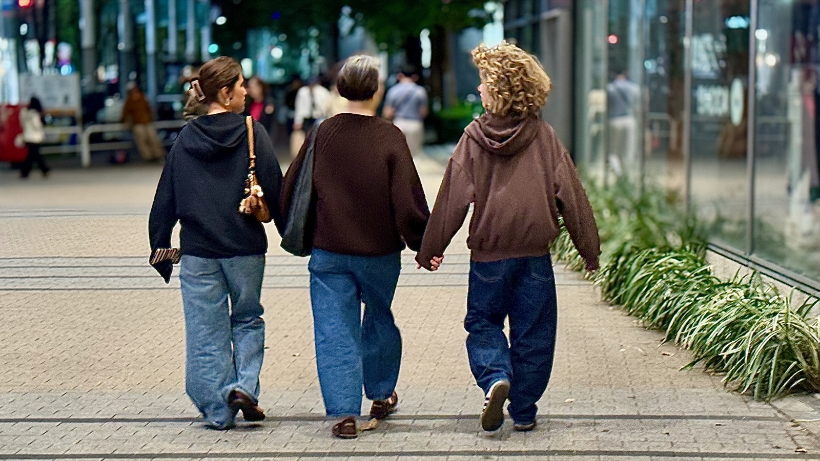 Seraphima, Natalia, and Luca walking home through Shinjuku at night