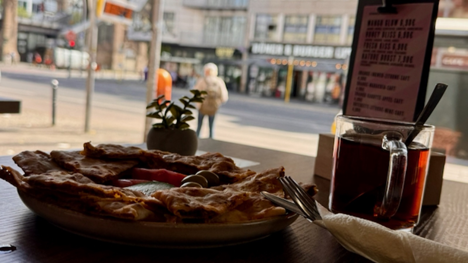Café breakfast in Schöneberg — börek, tea and Berlin street life outside